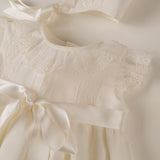 Skirt of christening With hood between them